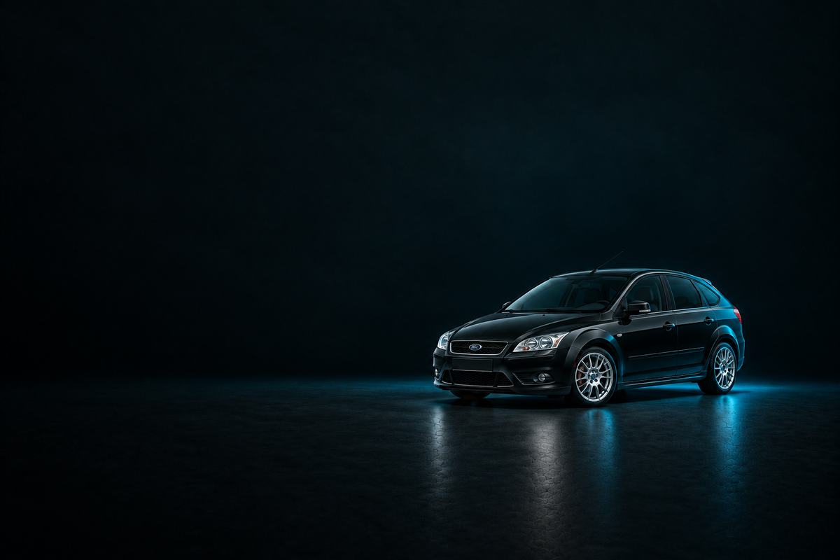 Black Ford Focus hatchback on a glossy dark floor with cyan edge lighting.