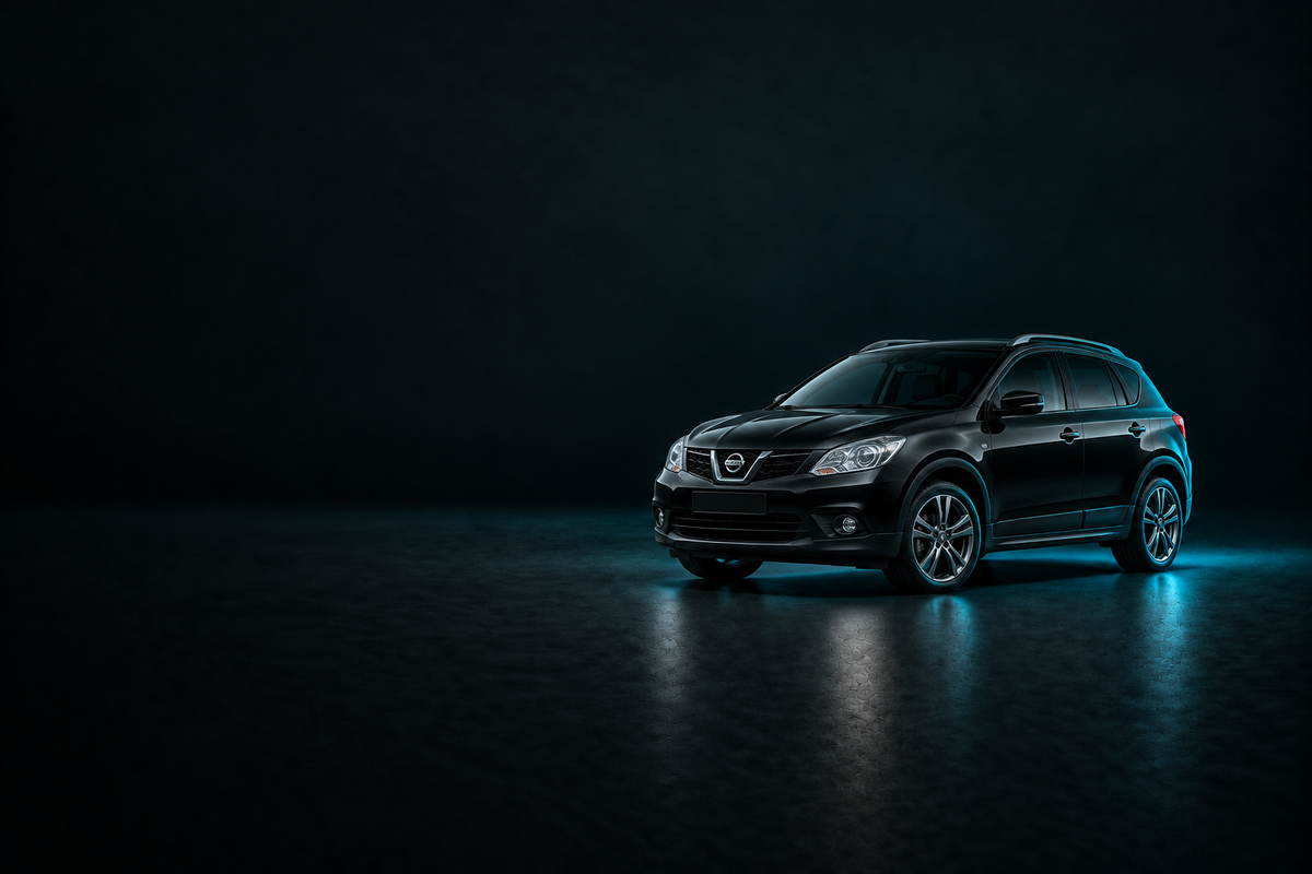 Black Nissan Qashqai J10 SUV on a charcoal background with cyan lighting.