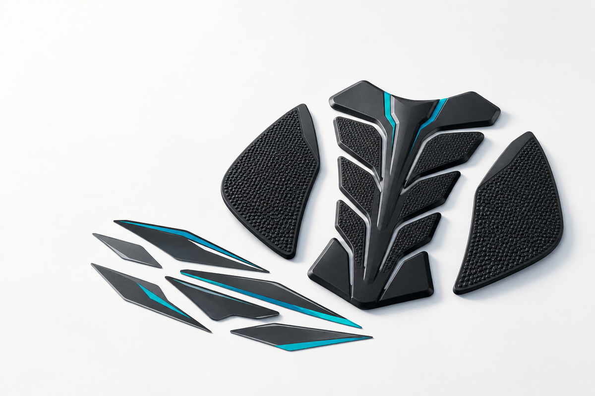 Black motorcycle tank pad, knee grips and teal-accented decals.