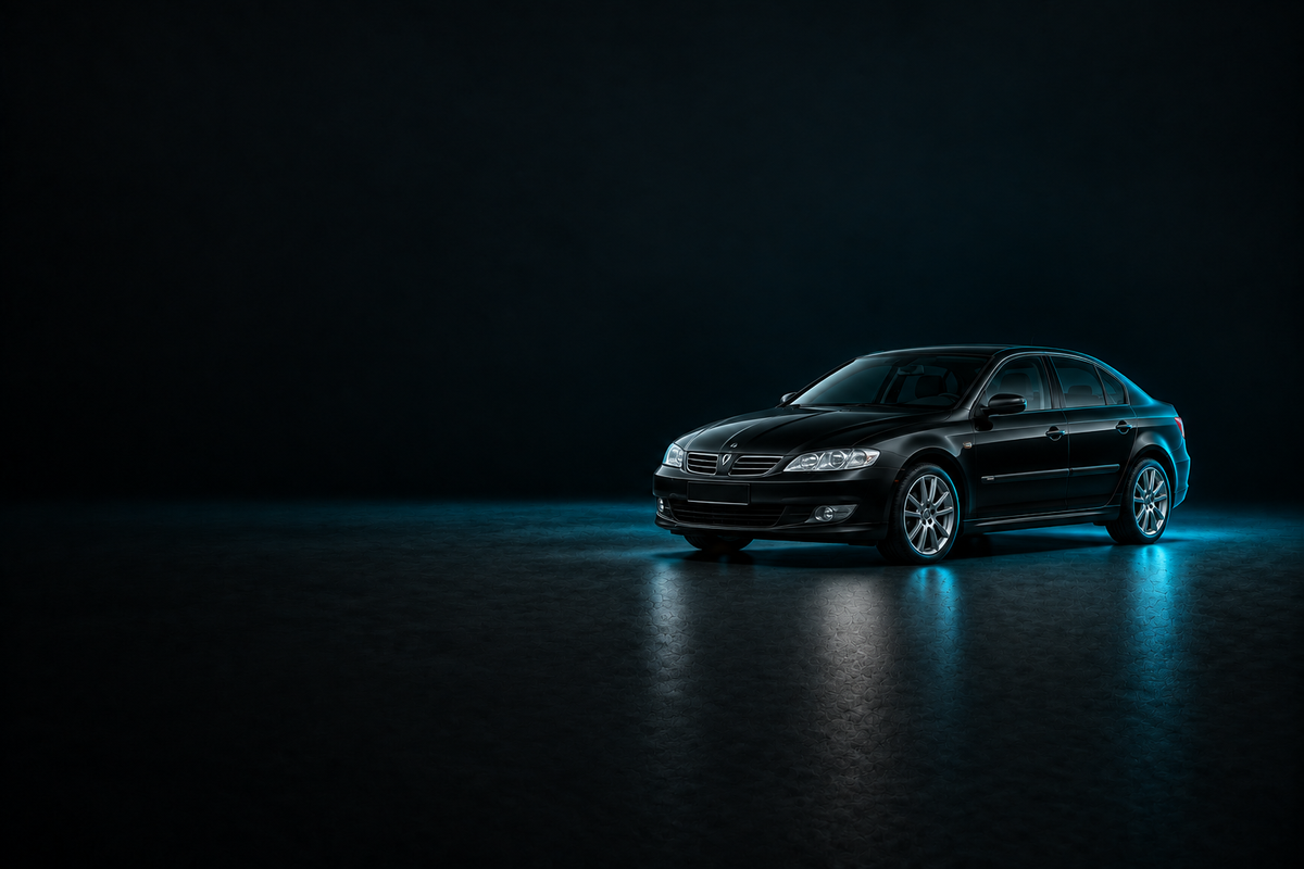 Black Renault Laguna X74 hatchback on a charcoal background with cyan lighting.