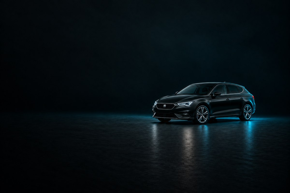 Black SEAT Leon hatchback in a dark studio with cool blue rim lighting.