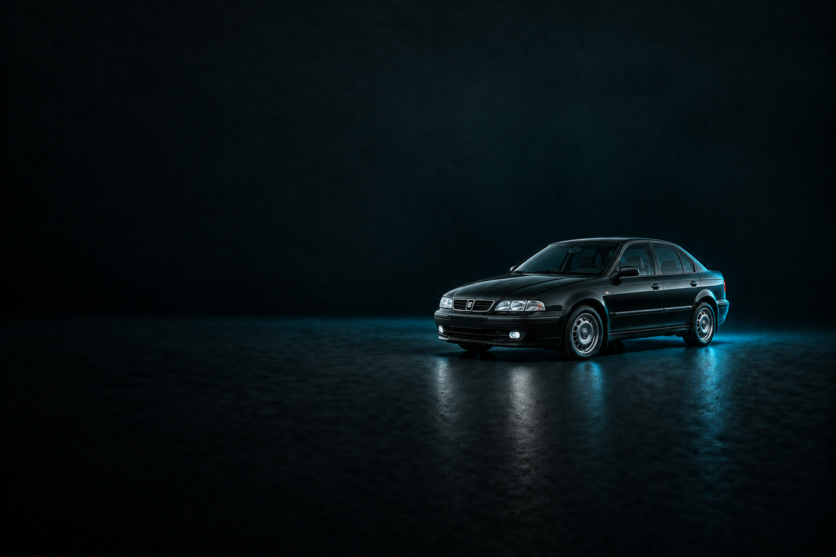 Black SEAT Toledo saloon in a dark studio with cyan rim lighting.