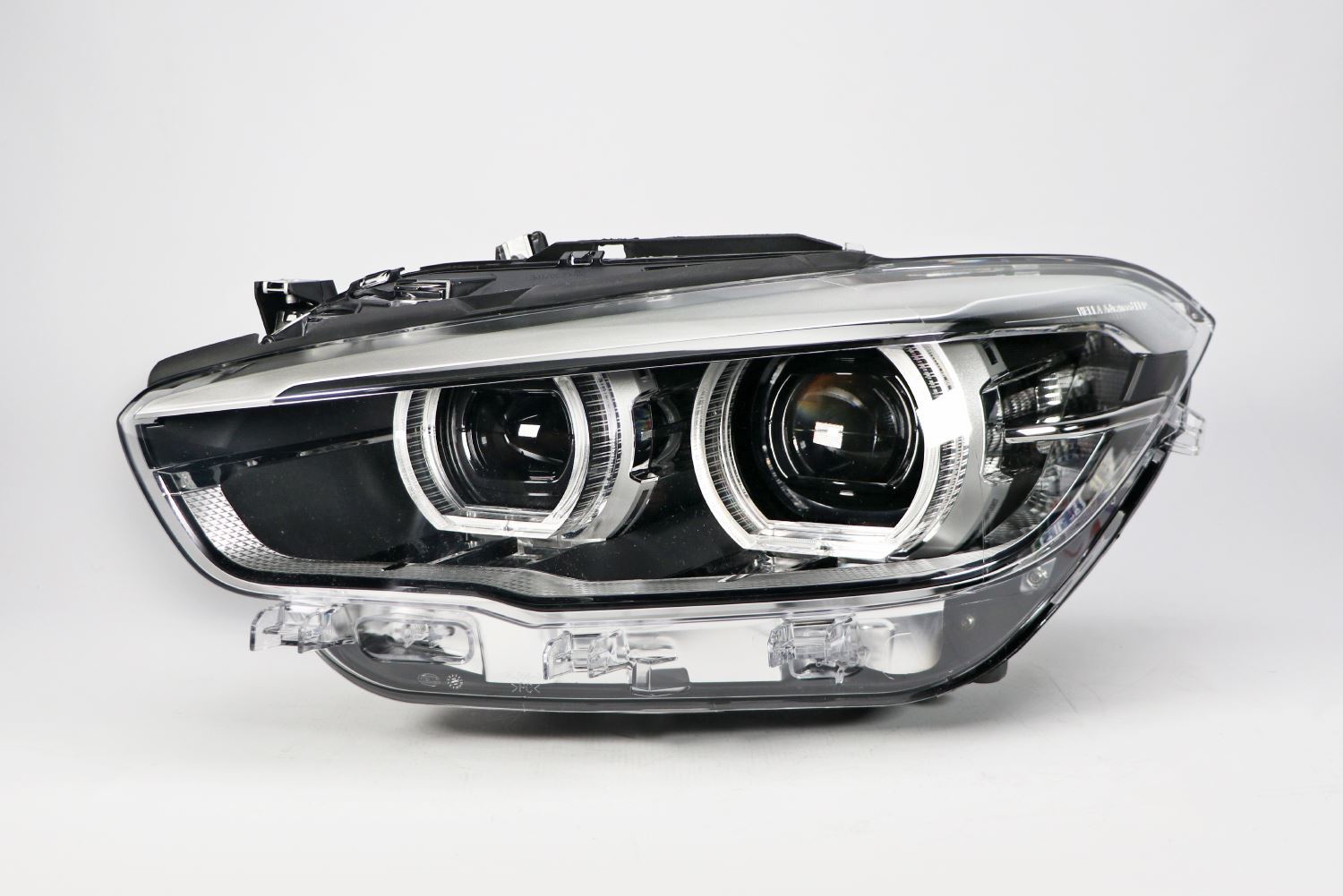 BMW 1 Series Left Headlight, Hella OEM, OEM 63117414147, MPN 1LX 011 930-431