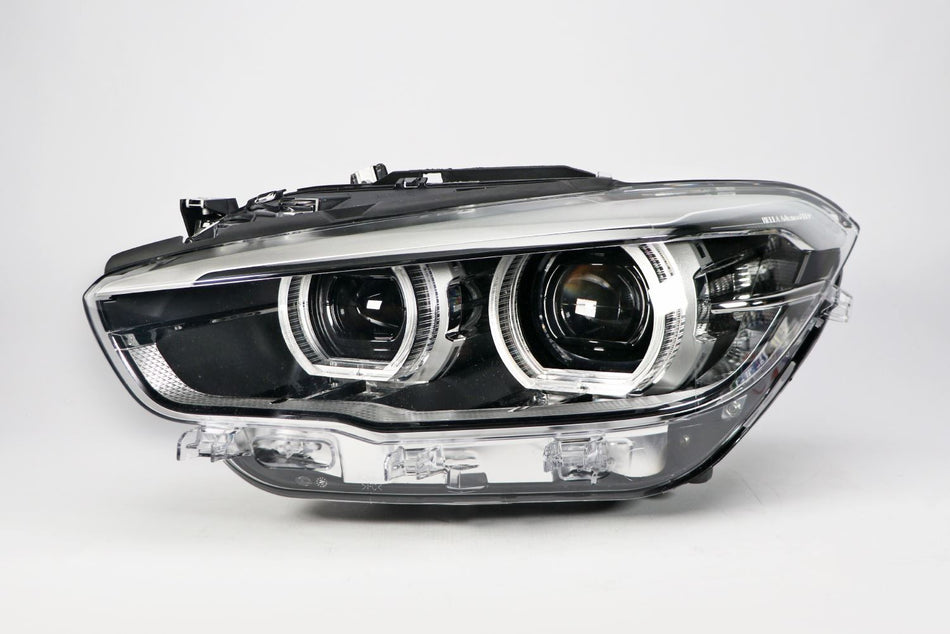 BMW 1 Series Left Headlight, Hella OEM, OEM 63117414147, MPN 1LX 011 930-431