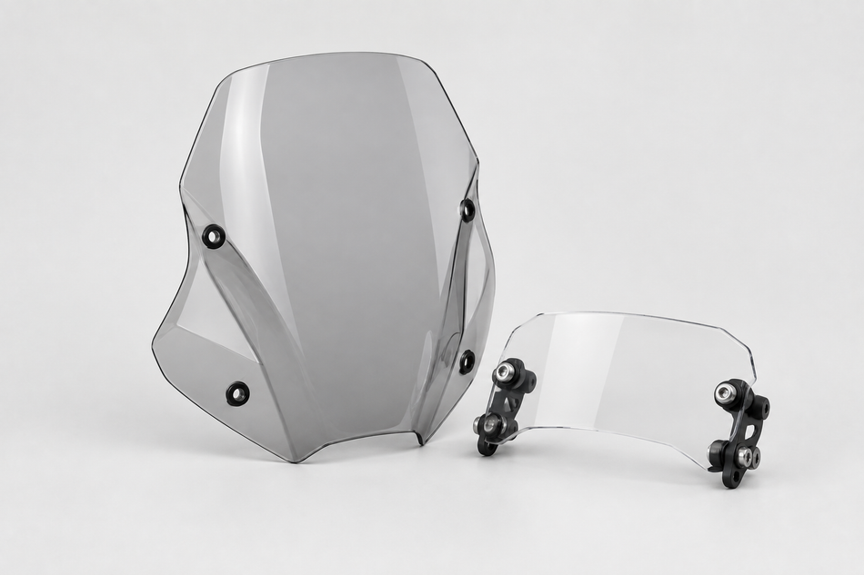 Clear motorcycle windscreen and smaller wind deflector on a light grey background.